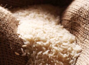 White Rice Grains On Sack Cloth