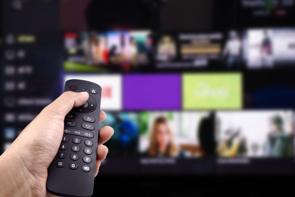 Hand Holding Tv Remote Control With Smart Tv 2048x1365